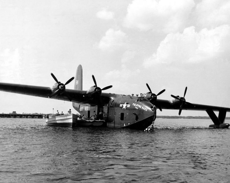 The Martin JRM-3 Philippine Mars (BuNo. 76820) of transport squadron VR-2 sits moored off the Naval Air Station Jacksonville sea wall, Florida (USA).