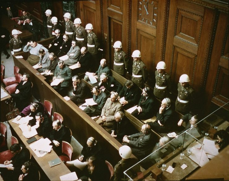 The trial at Nuremberg, depicting the defendants, guarded by American Military Police.1945