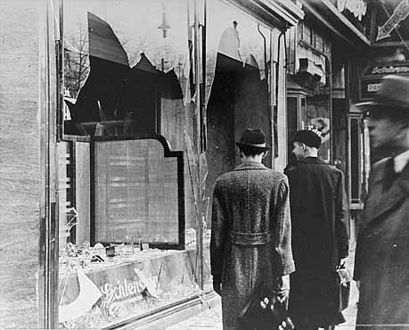 German citizens look the other way on nov. 10 1938, the day after Kristallnacht. What they see or don’t want to see are destroyed Jewish shops and houses.