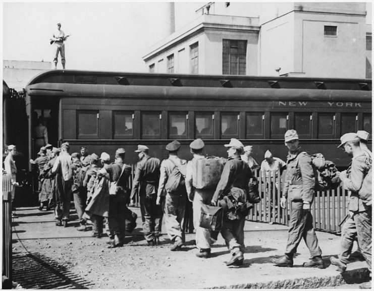 German POWs board a train in Boston