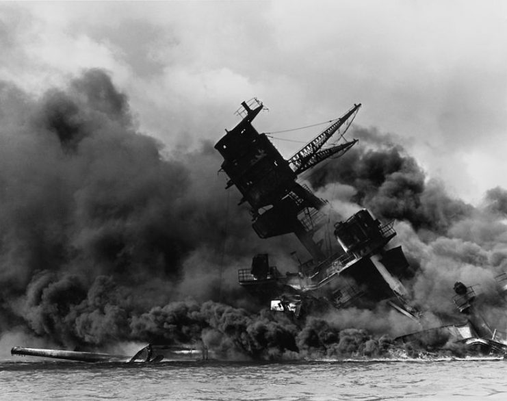 The USS Arizona (BB-39) burning after the Japanese attack on Pearl Harbor, December 7, 1941.