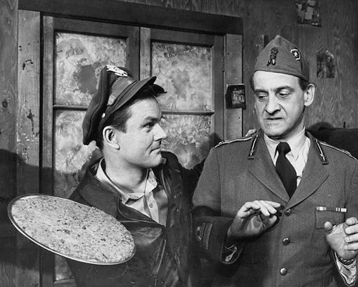 Publicity photo of Bob Crane as Col. Hogan with Hans Conried as a visiting Italian officer from the television show Hogan’s Heroes.