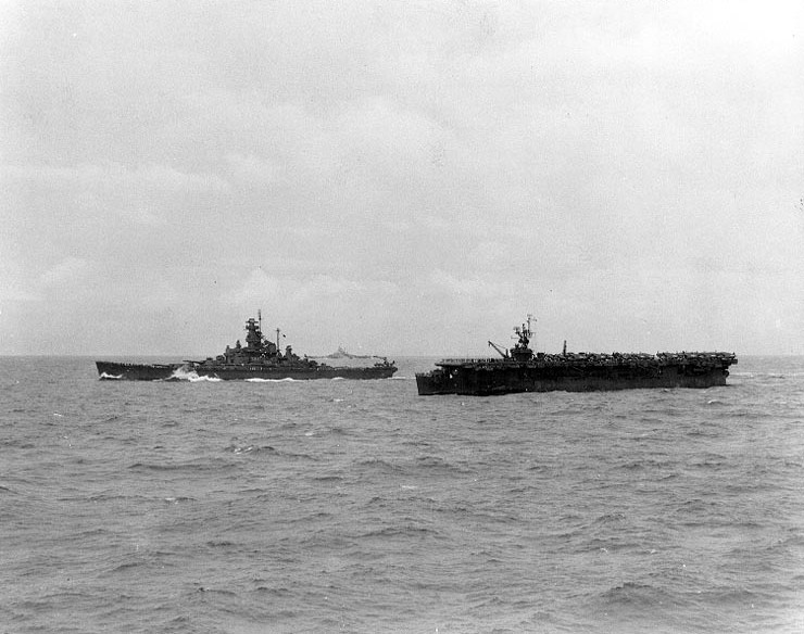 Gilberts Operation, November 1943: U.S. Navy ships of Task Force 50 en route to the Gilberts and Marshalls to support the invasions of Makin and Tarawa, 12 November 1943. Ships are (l-r): USS Alabama (BB-60); USS Indiana (BB-58), in the distance, wearing dazzle camouflage; and USS Monterey (CVL-26).