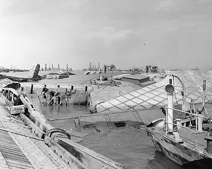Wrecked pontoon causeway of one of the “Mulberry” artificial harbours, following the storm of 19–22 June 1944.