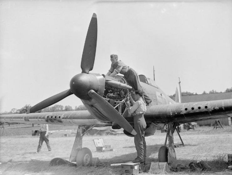 Mechanics servicing the engine of a Hurricane I