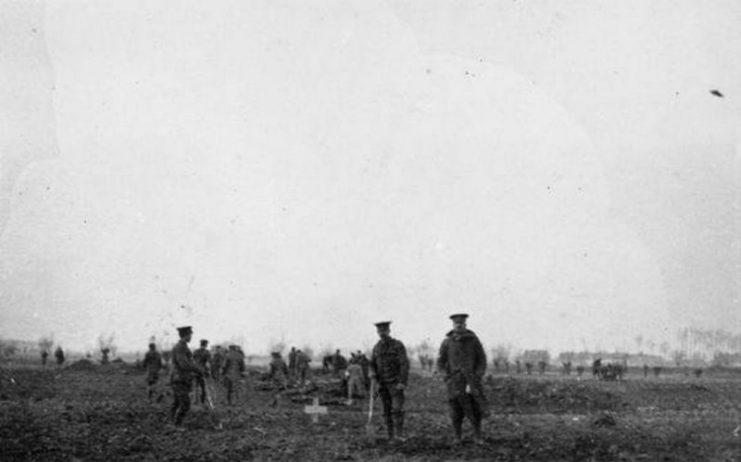 The Christmas Truce on the Western Front, 1914 British and German troops meeting in No-Man’s Land during the unofficial truce.Burying those killed in the attack of 18 December.