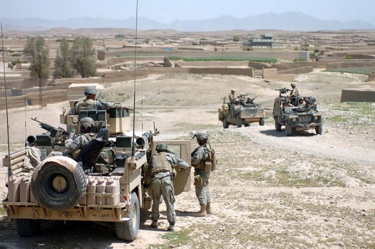 American and British soldiers patrolling through a town in Helmand Province, 2007