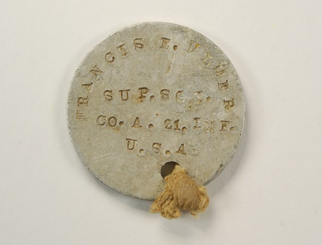 Francis Edgar Ulmer’s World War I-era round aluminum dog tag.NPS Photo