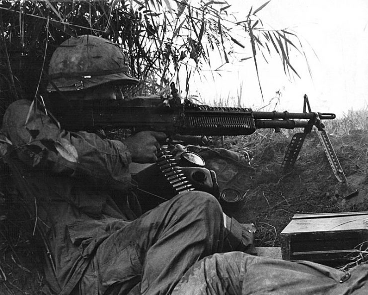 Sergeant Gerald Laird firing a machine gun, Company A, 1st Battalion, 502nd Infantry, 101st Airborne Division, Vietnam.