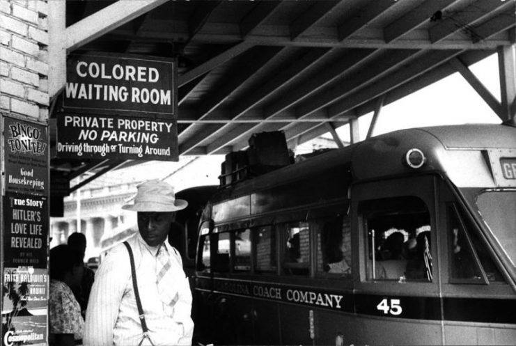 Sign for the “colored” waiting room at a bus station in Durham, North Carolina, May 1940
