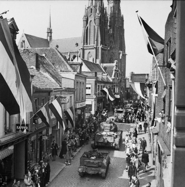 People of Eindhoven (during World War II) watching Allied forces entering the city following its liberation from Axis forces on 19 September 1944.