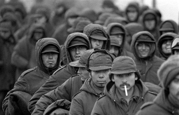 A hint of a smile on some of the faces of these Argentinian prisoners of war at Port Stanley, capital of the Falkland Islands, waiting to be repatriated via Montevideo. . (Photo by PA Images via Getty Images)