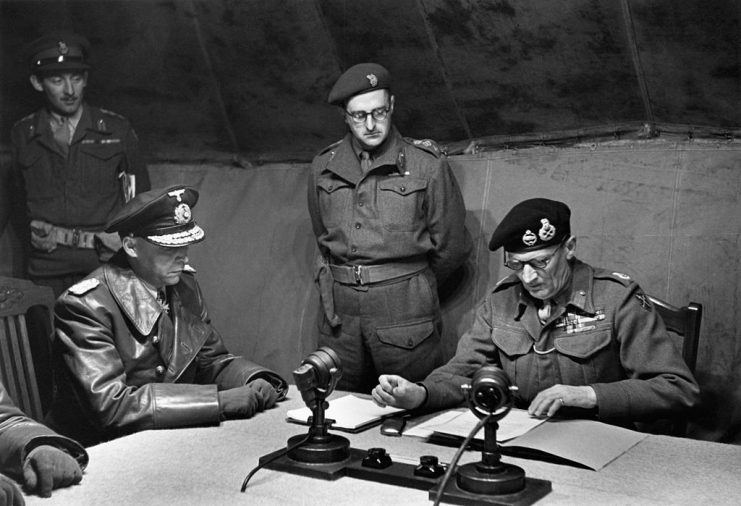 General Admiral Hans-Georg von Friedeburg (1895 – 1945) and Field Marshal Sir Bernard Law Montgomery (1887 – 1976) at the British camp on Luneburg Heath to sign the Instrument of Surrender of the German armed forces in Holland, north-west Germany and Denmark at the end of World War II, 4th May 1945. (Photo by George Rodger/The LIFE Picture Collection via Getty Images)