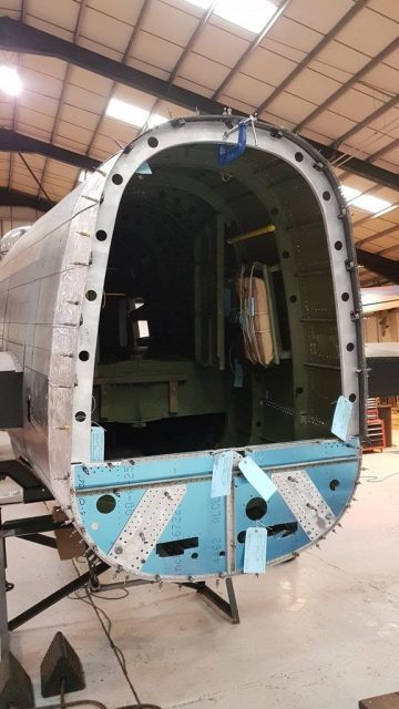 Offering up the bulkhead to transfer the holes from the former to the bulkead. Photo: Lincolnshire Aviation Heritage Centre