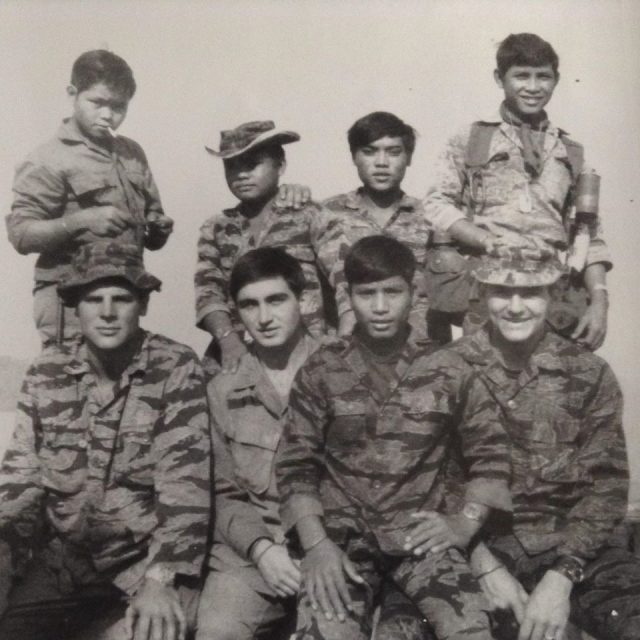 A Vietnam version of the Band of Brothers, 1969. Gary (front row, in hat) with fellow Green Beret forces and Montagnard fighters. They became close friends and allies.