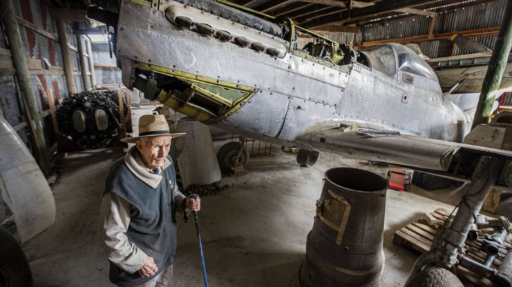 George Smith, 88, with the P-51 from his brother’s collection. It is hoped it can be restored to fly again. Credit: LUZ ZUNIGA/STUFF
