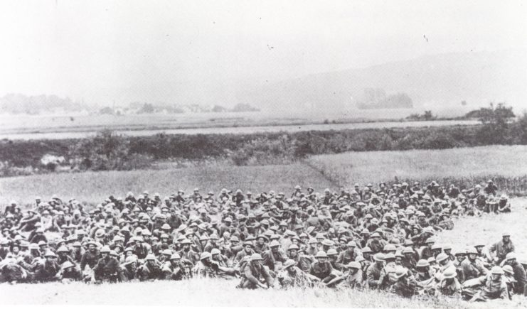 Here, after the battle, the exhausted and seriously depleted ranks of the 6th Marines gather outside Belleau Wood before moving on.