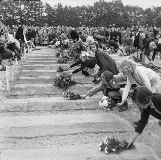 Dutch children lay flowers on graves of the fallen, September 1945.