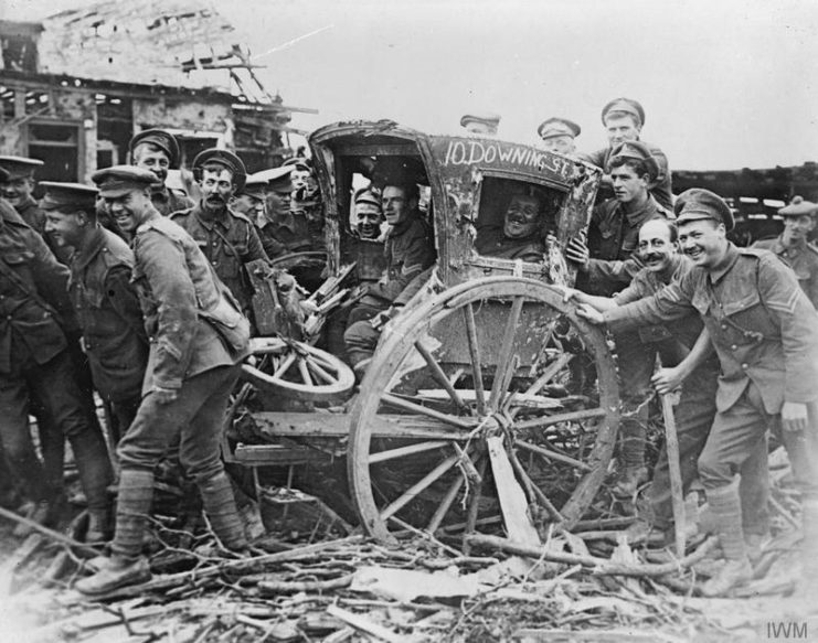 A derelict hansom cab found in Bazentin-le-Grand is renamed ’10 Downing Street’ and filled with grinning British soldiers.