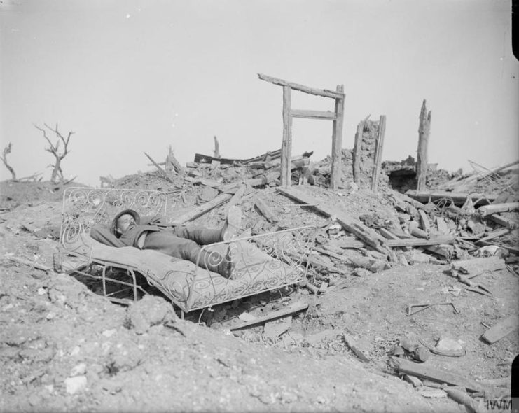 British soldier resting in the ruins in Morval. September 1916.