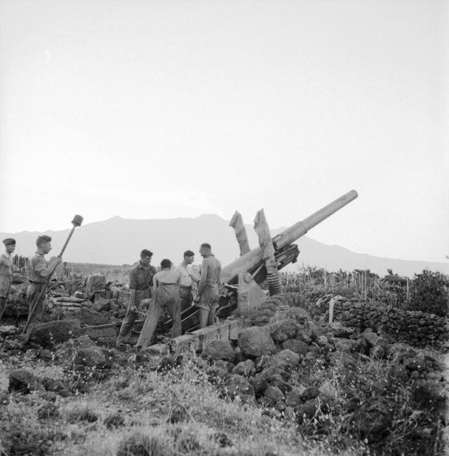 Gunners of 66 Medium Regiment Royal Artillery in action on the slopes of Mount Etna at dawn. 11 August 1943. [© IWM (NA 5854)]