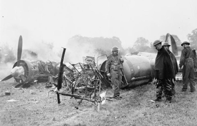 Soldiers guard the smoldering remains of Junkers Ju 88 (W.Nr. 4136: 3Z+BB) of I/KG 77 which crashed at Hertingfordbury, Hertfordshire on 3 October 1940.