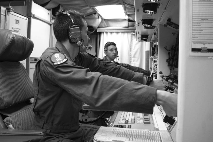 Missile combat crew commanders simulate key turns of the Minuteman III aging nuclear missile weapon system during a simulated test launch. U.S. Air Force photo.