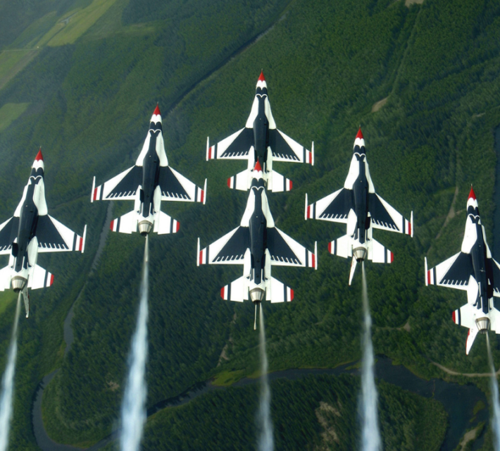 The Thunderbirds aerial demonstration team performs a loop while in the famous Delta formation
