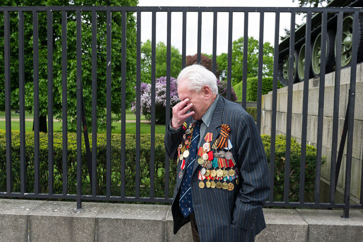 David Dushman overcome with emotion during a memorial service in Ukraine in 2015