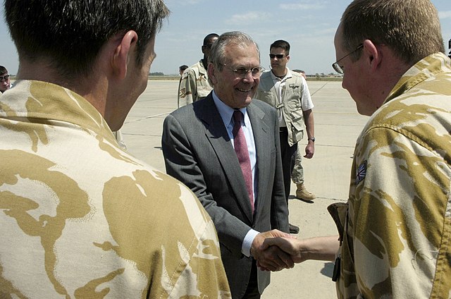 Donald Rumsfeld meeting with two British service members in Iraq