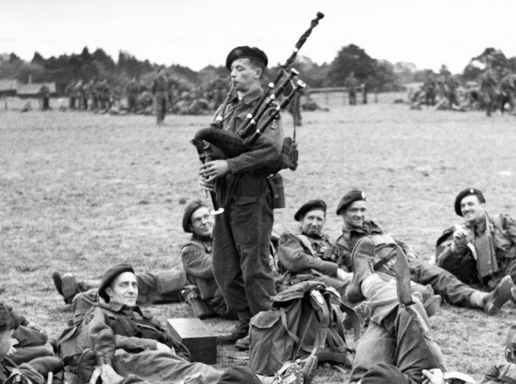 Bill Millin, piping for the troops in June 1944
