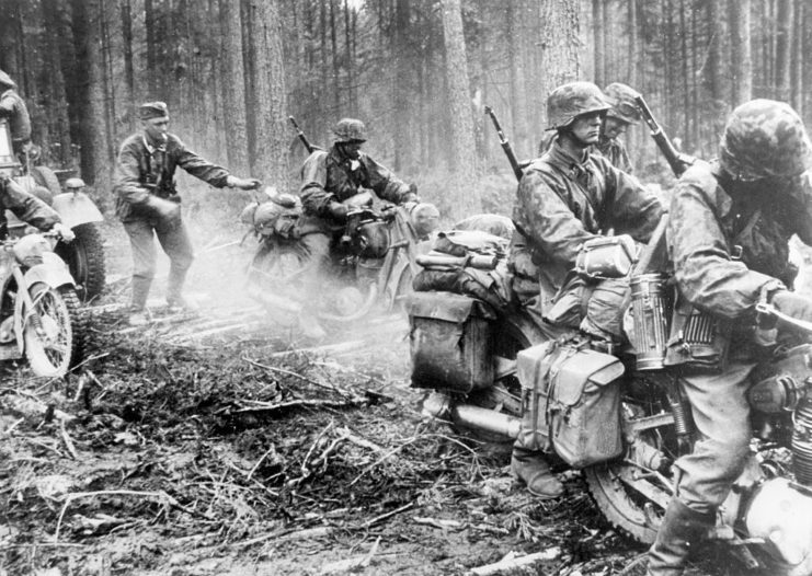 Waffen-SS soldiers travelling through the forest on the Eastern Front