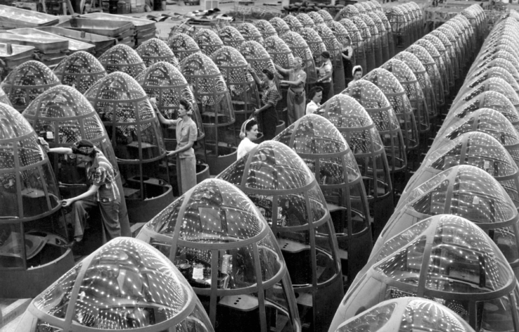 workers groom lines of transparent noses for deadly A-20 attack bombers.