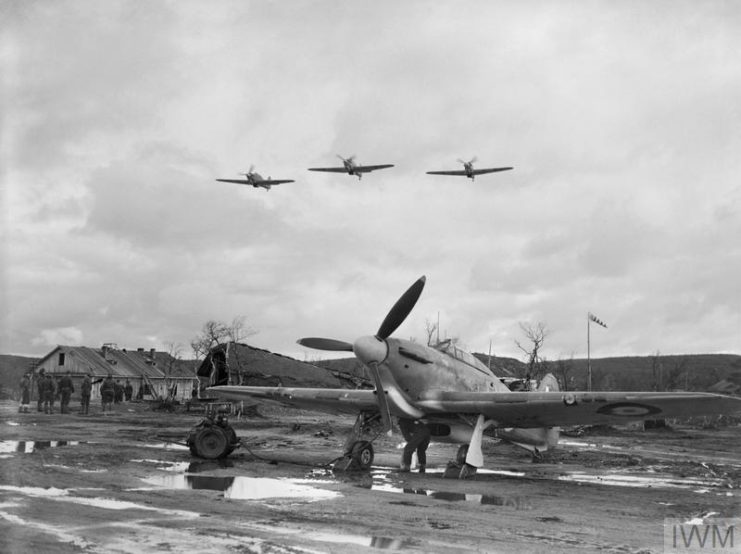Hawker Hurricane grounded while three fly overhead
