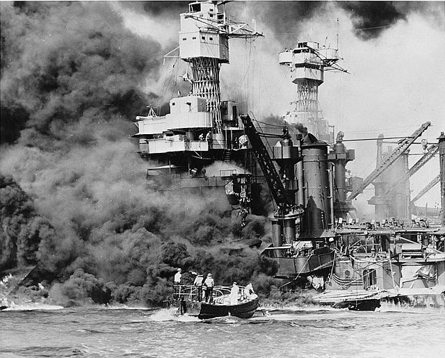 Sailors watching the USS West Virginia burn during the attack on Pearl Harbor