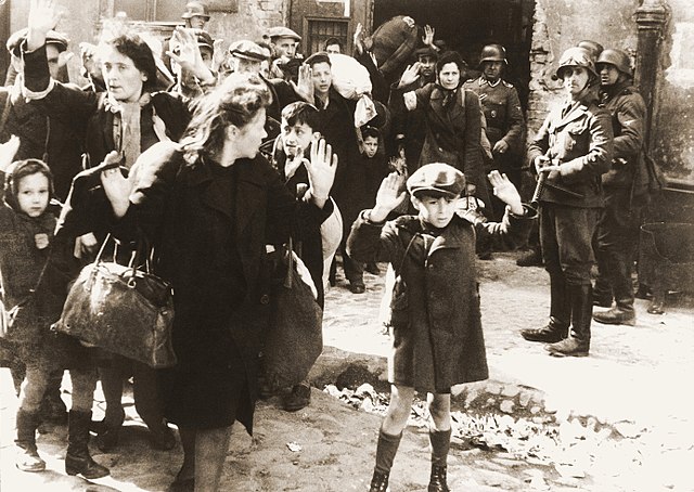 Polish Jews holding their hands up in surrender