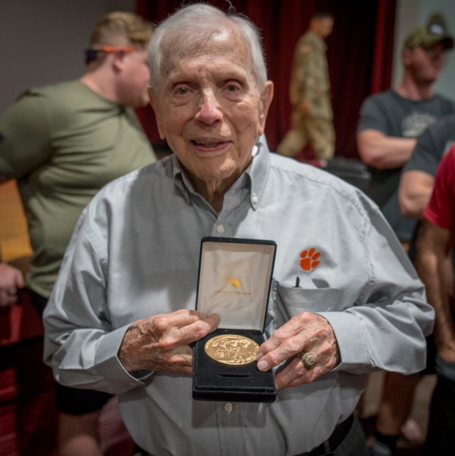 Ben Skardon holding his Congressional Medal