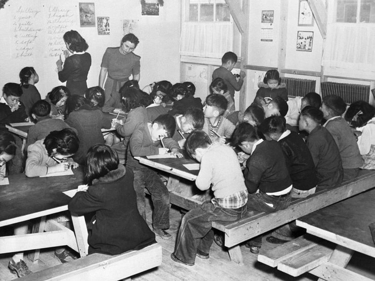 Japanese-American students being taught by Caucasian teachers at a Japanese internment camp