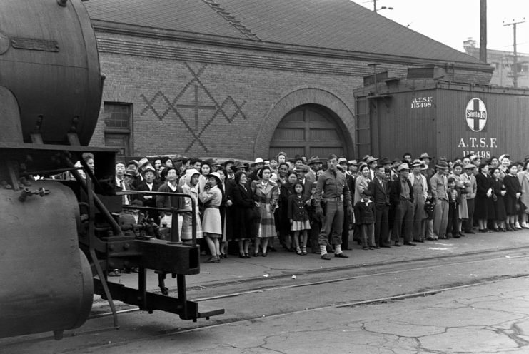 Japanese-Americans waiting at a train station