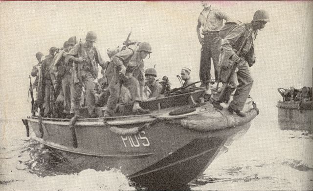 Soldiers sitting in a boat