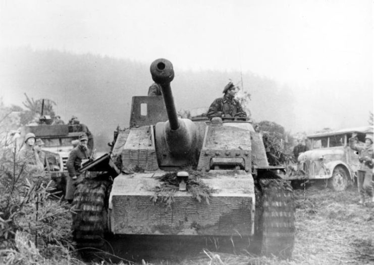 Sturmgeschutz with American M3 Half-track in background
