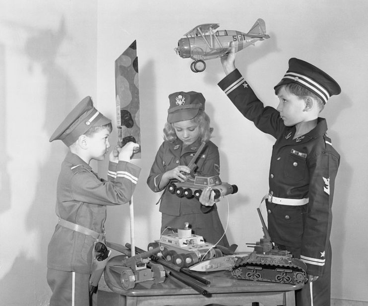 Children playing with Christmas presents
