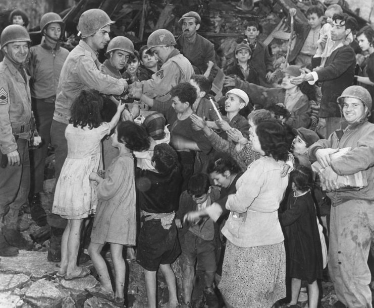American troops handing out toys to Italian children