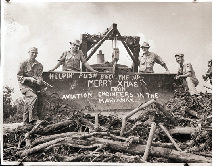 American Aviation Engineers standing with a Christmas message