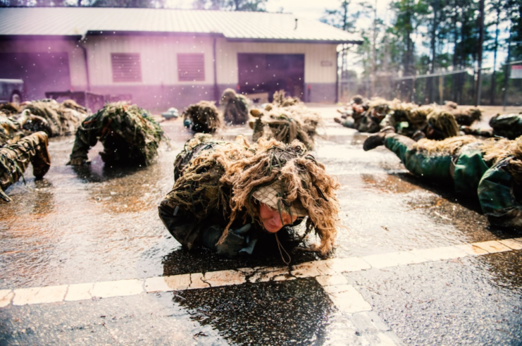 US Army Sniper School trainees lying on their stomachs