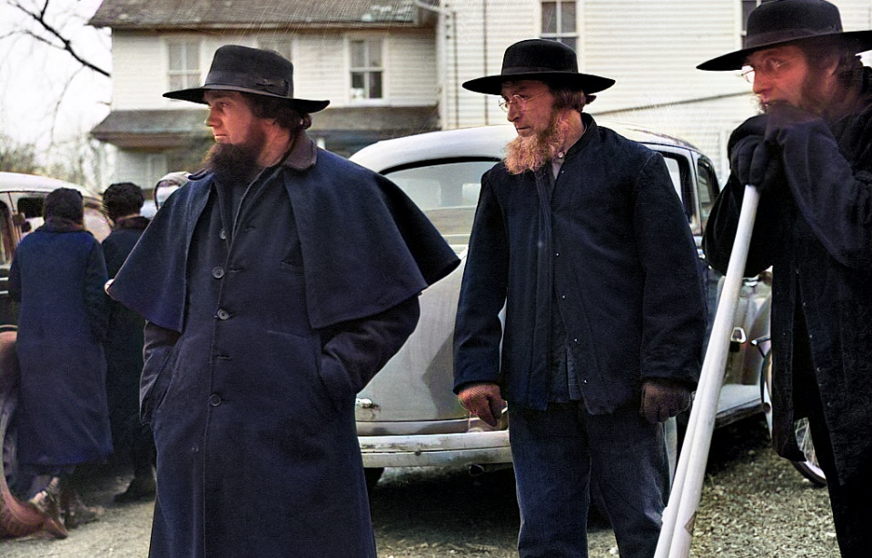 Three Amish men standing outside