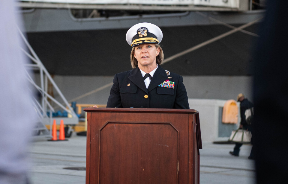 Capt. Amy Bauernschmidt speaking at a podium