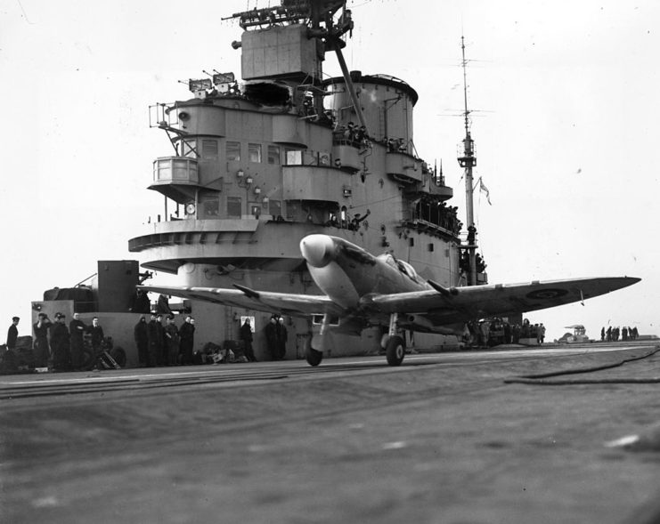 A cannon-armed Seafire fighter takes off from the deck of HMS Indomitable