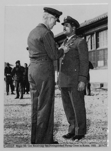 Military official presenting Charles McGee with the Distinguished Flying Cross