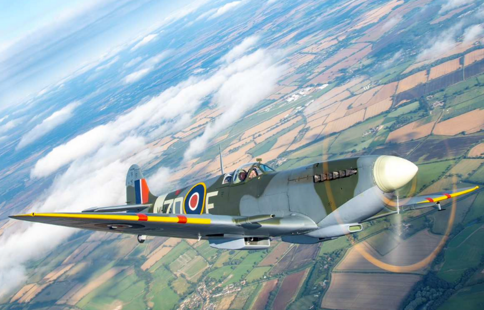 Supermarine Spitfire flying over the British countryside